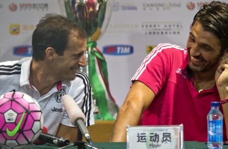 Juventus manager Massimiliano Allegri, left, and Juventus captain Gianluigi Buffon chat during a press conference ahead of the 2015 TIM Italian Supercup against Lazio at the Shanghai Stadium in Shanghai Thursday, Aug. 6, 2015. (AP Photo/Ng Han Guan)