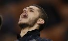 FILE - In this file photo dated Sunday, March 15, 2015, Inter Milan's Mauro Icardi, reacts after missing a chance to score during a Serie A soccer match against Cesena, at the San Siro stadium in Milan, Italy.  Prolific striker Mauro Icardis arrival at French champion Paris Saint-Germain impressed with 20 goals in 31 games when the league season was stopped because of the coronavirus pandemic. (AP Photo/Luca Bruno, FILE)