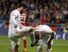 Spain's Sergio Ramos, right, kisses the shoe of Spain's Isco Alarcon, left, after scoring during the international friendly soccer match between Spain and Argentina at the Wanda Metropolitano stadium in Madrid, Spain, Tuesday March 27, 2018. Spain defeated Argentina with 6-1, Isco scored three goals. (AP Photo/Paul White)