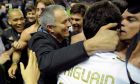 Real Madrid's coach coach Jose Mourinho from Portugal, center, celebrates with his team after they won the Spanish League during their Spanish La Liga soccer match, against Athletic Bilbao, at San Mames stadium in Bilbao, northern Spain, Wednesday, May 2, 2012. (AP Photo/Alvaro Barrientos)