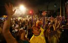 SAO PAULO, BRAZIL - JUNE 12:  Fans celebrate in Vila Madalena after Brazil won their opening match over Croatia on June 12, 2014 in Sao Paulo, Brazil. This is the first day of the 2014 FIFA World Cup.  (Photo by Mario Tama/Getty Images)
