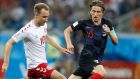 Croatia's Luka Modric, right, and Denmark's Christian Eriksen challenge for the ball during the round of 16 match between Croatia and Denmark at the 2018 soccer World Cup in the Nizhny Novgorod Stadium, in Nizhny Novgorod , Russia, Sunday, July 1, 2018. (AP Photo/Efrem Lukatsky)