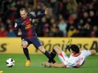 Barcelona's midfielder Andres Iniesta (L) vies with Sevilla's defender Tomas Alberto Botia (R) during the Spanish league football match FC Barcelona vs Sevila FC at the Camp Nou stadium in Barcelona on February 23, 2013. AFP PHOTO / LLUIS GENE.        (Photo credit should read LLUIS GENE/AFP/Getty Images)