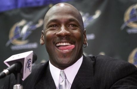 FILE -- This is a Jan. 19, 2000 file photo showing Michael Jordan smiling as he answers questions from the media at the MCI Center in Washington. President Barack Obama was asked straight out on Thursday, July 2, 2009: Kobe or Michael? "Oh, Michael," Obama answered in an interview with The Associated Press. (AP Photo/Pablo Martinez Monsivais, File)