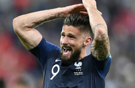 France's Olivier Giroud celebrates after his team advanced to the final after the semifinal match between France and Belgium at the 2018 soccer World Cup in the St. Petersburg Stadium in St. Petersburg, Russia, Tuesday, July 10, 2018. (AP Photo/Martin Meissner)
