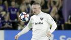 D.C. United's Wayne Rooney moves the ball against Orlando City during the second half of an MLS soccer match, Sunday, March 31, 2019, in Orlando, Fla. (AP Photo/John Raoux)