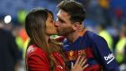 Barcelona's Lionel Messi kisses his wife Antonella Roccuzzo as they celebrate after winning the final of the Copa del Rey soccer match between FC Barcelona and Sevilla FC at the Vicente Calderon stadium in Madrid, Sunday, May 22, 2016. Barcelona won 2-0 (AP Photo/Francisco Seco)