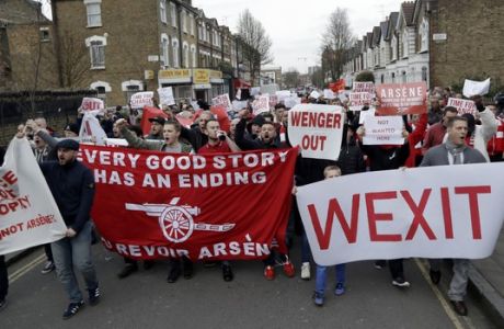 Arsenal fans march calling for the resignation of French manager Arsene Wenger ahead of their English FA Cup quarterfinal soccer match against Lincoln City at the Emirates stadium in London, Saturday, March 11, 2017. (AP Photo/Matt Dunham)