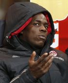 AC Milan's Mario Balotelli sits on the bench prior to the start of the Italian Cup soccer match between AC Milan and Carpi at the San Siro stadium in Milan, Italy, Wednesday, Jan. 13, 2016. (AP Photo/Antonio Calanni)