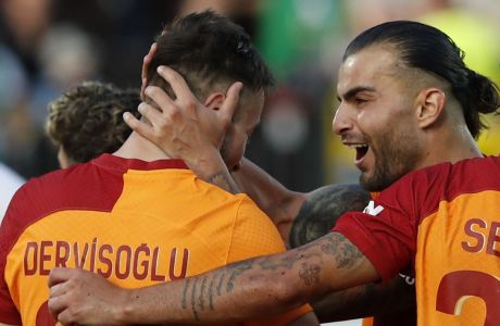 Galatasaray's Halil Dervisoglu, left, celebrates after scoring his side's second goal with Abdulkerim Bardakci during the Champions League, second qualifying round, first leg soccer match between Zalgiris and Galatasaray at the LFF stadium in Vilnius, Lithuania, Tuesday, July 25, 2023. (AP Photo/Mindaugas Kulbis)