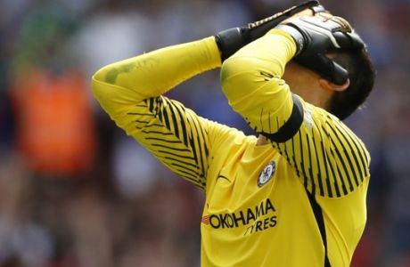 Chelsea's goalkeeper Thibaut Courtois reacts after failing to score a penalty during the English Community Shield soccer match between Arsenal and Chelsea at Wembley Stadium in London, Sunday, Aug. 6, 2017. (AP Photo/Kirsty Wigglesworth)