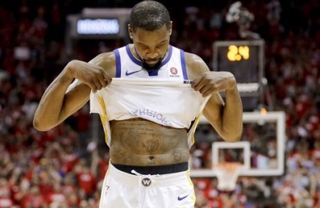 Golden State Warriors forward Kevin Durant reacts in the final seconds of the team's 98-94 loss to the Houston Rockets in Game 5 of the NBA basketball playoffs Western Conference finals in Houston, Thursday, May 24, 2018. (AP Photo/David J. Phillip)