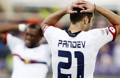 Genoa's Goran Pandev touches his head during a Serie A soccer match against Fiorentina at the Artemio Franchi stadium in Florence, Italy, Saturday, Sept. 12, 2015. (AP Photo/Fabrizio Giovannozzi)