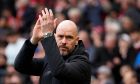 Manchester United's head coach Erik ten Hag applauds during the English Premier League soccer match between Manchester United and Liverpool at the Old Trafford stadium in Manchester, England, Sunday, April 7, 2024. (AP Photo/Dave Thompson)