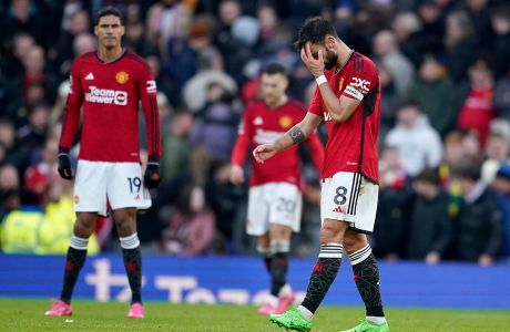 Manchester United players react after losing the English Premier League soccer match between Manchester United and Fulham at Old Trafford stadium in Manchester, Saturday, Feb. 24, 2024.(AP Photo/Dave Thompson)