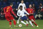 In his debut match for England, Callum Hudson-Odoi, center, vies for the ball with Montenegro's Aleksandar Boljevic, left, and Montenegro's Marko Jankovic, right, during the Euro 2020 group A qualifying soccer match between Montenegro and England at the City Stadium in Podgorica, Montenegro, Monday, March 25, 2019. (AP Photo/Darko Vojinovic)
