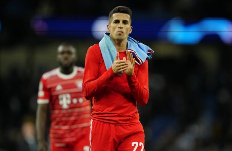 Bayern's Joao Cancelo applauds fans at the end of the Champions League quarterfinal, first leg, soccer match between Manchester City and Bayern Munich at the Etihad stadium in Manchester, England, Tuesday, April 11, 2023. Manchester City won 3-0. (AP Photo/Jon Super)