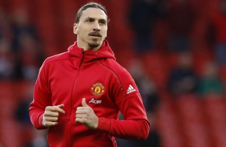 Manchester United's Zlatan Ibrahimovic warms up before the English Premier League soccer match between Manchester United and Everton at Old Trafford in Manchester, England, Tuesday April 4, 2017. (Martin Rickett/PA via AP)