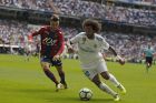 Real Madrid's Marcelo, right, battles for the ball with Levante's David Remeseiro "Jason" during the Spanish La Liga soccer match between Real Madrid and Levante at the Santiago Bernabeu stadium in Madrid, Saturday, Sept. 9, 2017. (AP Photo/Francisco Seco)