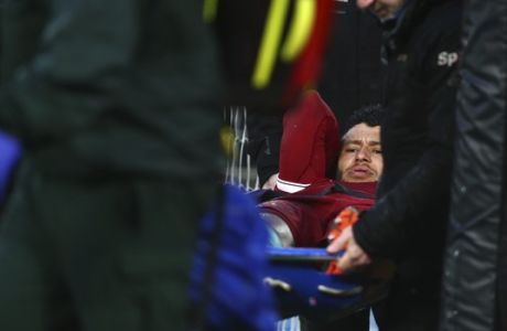 Liverpool's Alex Oxlade-Chamberlain is carried on a stretcher after getting injured during the Champions League semifinal, first leg, soccer match between Liverpool and AS Roma at Anfield Stadium, Liverpool, England, Tuesday, April 24, 2018. (AP Photo/Dave Thompson)
