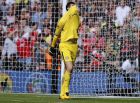 Chelsea's goalkeeper Thibaut Courtois reacts after losing the English Community Shield soccer match between Arsenal and Chelsea at Wembley Stadium in London, Sunday, Aug. 6, 2017. (AP Photo/Frank Augstein)