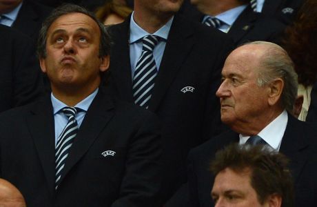 FIFA president Sepp Blatter (R) and UEFA president Michel Platini attend the Euro 2012 football championships semi-final match Germany vs Italy on June 28, 2012 at the National Stadium in Warsaw. Italy won 2-1. AFP PHOTO/ PATRIK STOLLARZ