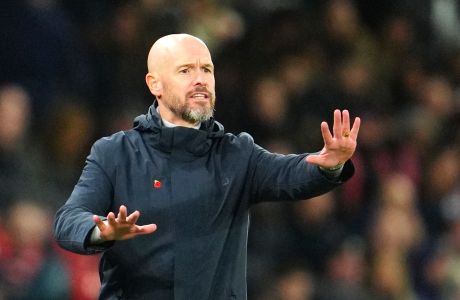 Manchester United's head coach Erik ten Hag reacts during the English Premier League soccer match between Manchester United and Luton Town at the Old Trafford stadium in Manchester, England, Saturday, Nov. 11, 2023. (AP Photo/Jon Super)