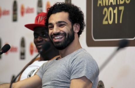 Mohamed Salah smiles during a news conference after winning the African Player of the Year award at the Confederation of African Football awards ceremony in Accra, Ghana, Thursday Jan. 4, 2018. Salah won the award for success on all fronts in 2017 for the Egypt forward after he inspired his country to a long-awaited World Cup place and had a phenomenal start to his career at Liverpool. (AP Photo/Christian Thompson)