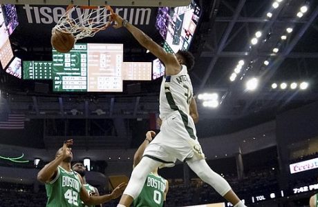 Milwaukee Bucks' Giannis Antetokounmpo dunks during the first half of Game 2 of a second round NBA basketball playoff series against the Boston Celtics Tuesday, April 30, 2019, in Milwaukee. (AP Photo/Morry Gash)