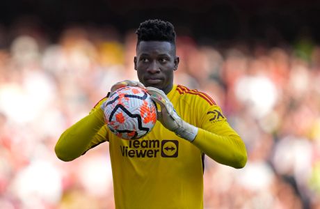 Manchester United's goalkeeper Andre Onana reacts after a penalty awarded to Arsenal is overturned in VAR review during the English Premier League soccer match between Arsenal and Manchester United at Emirates stadium in London, Sunday, Sept. 3, 2023. (AP Photo/Kirsty Wigglesworth)