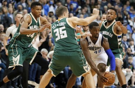 Dallas Mavericks forward Harrison Barnes (40) maneuvers to get out of coverage by Milwaukee Bucks' Giannis Antetokounmpo (34) of Greece, Mirza Teletovic (35) of Bosnia and Herzegovina and Jabari Parker, right rear, in overtime of an NBA basketball game, Sunday, Nov. 6, 2016, in Dallas. (AP Photo/Tony Gutierrez)