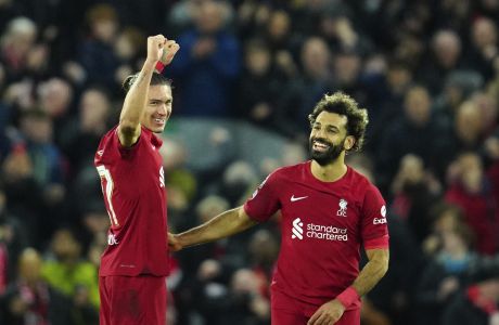 Liverpool's Darwin Nunez, left, and Liverpool's Mohamed Salah celebrate at the end of the Champions League Group A soccer match between Liverpool and Napoli, at Anfield stadium in Liverpool, England, Tuesday, Nov. 1, 2022. (AP Photo/Jon Super)