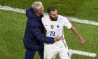 France's manager Didier Deschamps, left, embraces Karim Benzema as he leaves the pitch during the UEFA Nations League semifinal soccer match between Belgium and France at the Juventus stadium, in Turin, Italy, Thursday, Oct. 7, 2021. (Massimo Rana/Pool Photo via AP)