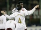 Arsenal forward Emmanuel Adebayor, of Togo, right, celebrates with his teammate Cesc Fabregas, of Spain, at the end of a Champions League, Round of 16, return-leg soccer match at the San Siro stadium, in Milan, Italy, Tuesday, March 4, 2008. Arsenal won 2-0 and advances to the quarterfinals. (AP Photo/Luca Bruno)