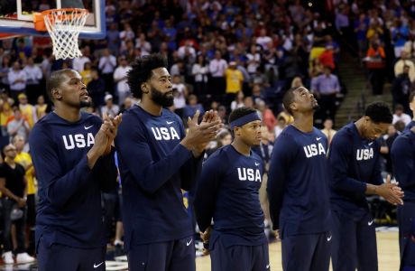 Members of the United States applaud during an exhibition basketball game against China Tuesday, July 26, 2016, in Oakland, Calif. (AP Photo/Marcio Jose Sanchez)