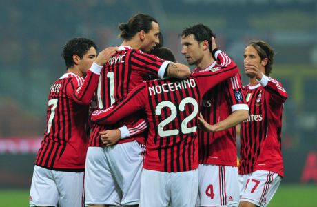 AC Milan's Swedish forward Zlatan Ibrahimovic (C) celebrates with teammates after scoring during the Italian Serie A football match between AC  Milan and Chievo on November 27, 2011 at San Siro Stadium in Milan. AFP PHOTO / GIUSEPPE CACACE (Photo credit should read GIUSEPPE CACACE/AFP/Getty Images)