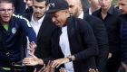France soccer team player Kylian Mbappe high-fives children during a visit at the Leo Lagrange stadium in his hometown of Bondy, east of Paris, Wednesday, Oct. 17, 2018. (AP Photo/Thibault Camus)