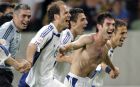 epa000220254 Greek players celebrate after winning the EURO 2004 quarter final match between France and Greece at the stadium Jose de Alvalade in Lisbon on Friday, 25 June 2004.  Greece won 1-0.  EPA/BERND WEISSBROD NO MOBILE PHONE APPLICATIONS
