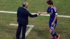 Japan's Yuya Osako, right, shakes hands with head coach Alberto Zaccheroni after he was substituted during the group C World Cup soccer match between Japan and Greece at the Arena das Dunas in Natal, Brazil, Thursday, June 19, 2014. (AP Photo/Hassan Ammar)