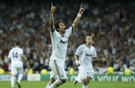 MADRID, SPAIN - SEPTEMBER 18: Marcelo of Real Madrid celebrates scoring his sides equalizing goal during the UEFA Champions League group D match between Real Madrid and Manchester City FC at the Estadio Santiago Bernabeu on September 18, 2012 in Madrid, Spain.  (Photo by Jasper Juinen/Getty Images)