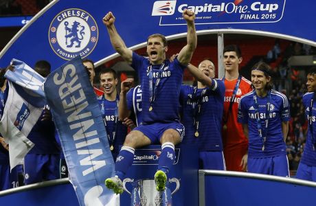 Chelsea's Branislav Ivanovic celebrates with his teammates after they won the English League Cup final soccer match between Chelsea and Tottenham at Wembley stadium in London, Sunday, March 1, 2015. (AP Photo/Kirsty Wigglesworth) 