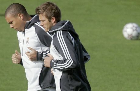 **  FILE  ** Real Madrid's Ronaldo, left and David Beckham are seen training in this Nov. 20, 2006 file photo in Madrid. Real Madrid coach Fabio Capello on Wednesday Jan. 17, 2007, suggested that he may remove the bar to David Beckham playing for the team. Capello said last Saturday that Beckham would no longer play for Madrid now he has committed to Los Angeles Galaxy and would only be able to train. Ronaldo, who has been made available for transfer by Madrid has already agreed to a 1 1/2-year contract with AC Milan, according to Italian media, data-although the clubs have still to settle on a transfer fee. (AP Photo/Paul White, File)