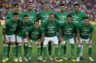 Betis players pose with a message on their shirts reading ' Real Betis with Barcelona' before observing a minute of silence for the victims of the van attacks before a La Liga soccer match between Barcelona and Betis at the Camp Nou stadium in Barcelona, Spain, Sunday, Aug. 20, 2017. Security was stepped up for the match after a terror attack that killed 14 people and wounded over 120 in Barcelona and police put up scores of roadblocks across northeast Spain on Sunday in hopes of capturing a fugitive suspect at large following the vehicle attack. Barcelona players are all wearing shirts with 'Barcelona' on their backs tonight, rather than their names to pay homage to the van attack victims. (AP Photo/Manu Fernandez)
