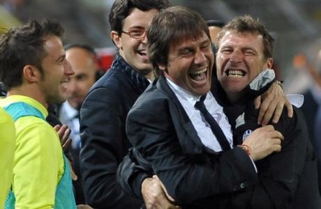 Juventus  coach Antonio Conte, center, Massimo Carrera, right, and Alessandro Del Piero celebrate their team 2-0 win over Cagliari at the end of a Serie A soccer match in Trieste, Italy, Sunday, May 6, 2012. Juventus clinched the Serie A title. (AP Photo/Massimo Pinca)