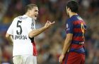 Leverkusen's Kyriakos Papadopoulos argues with Barcelona's Luis Suarez during a Champions League Group E soccer match between Barcelona and Bayer Leverkusen at the Camp Nou stadium in Barcelona, Spain, Monday, July 20, 2015. (AP Photo/Manu Fernandez)