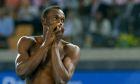 Usain Bolt of Jamaica walks without his shirt after being disqualified for a false start during the men's 100 metres final at the IAAF World Championships in Daegu August 28, 2011.     REUTERS/Phil Noble (SOUTH KOREA  - Tags: SPORT ATHLETICS)  