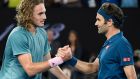 Greece's Stefanos Tsitsipas, left, is congratulated by Switzerland's Roger Federer after winning their fourth round match at the Australian Open tennis championships in Melbourne, Australia, Sunday, Jan. 20, 2019. (AP Photo/Andy Brownbill)