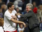 Bayern Munich's coach Jupp Heynckes (R) and Mario Gomez celebrate victory against Real Madrid after their Champions League semi-final second leg soccer match at Santiago Bernabeu stadium in Madrid, April 25, 2012.              REUTERS/Sergio Perez (SPAIN  - Tags: SPORT SOCCER)  