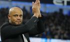 Burnley's head coach Vincent Kompany applauds before the English FA Cup quarter final soccer match between Manchester City and Burnley at the Etihad stadium in Manchester, England, Saturday, March 18, 2023. (AP Photo/Jon Super)