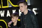 Brooklyn and Romeo Beckham, left, pose for photographers upon arrival at the European premiere of the film 'Star Wars: The Force Awakens ' in London, Wednesday, Dec. 16, 2015. (Photo by Joel Ryan/Invision/AP)
